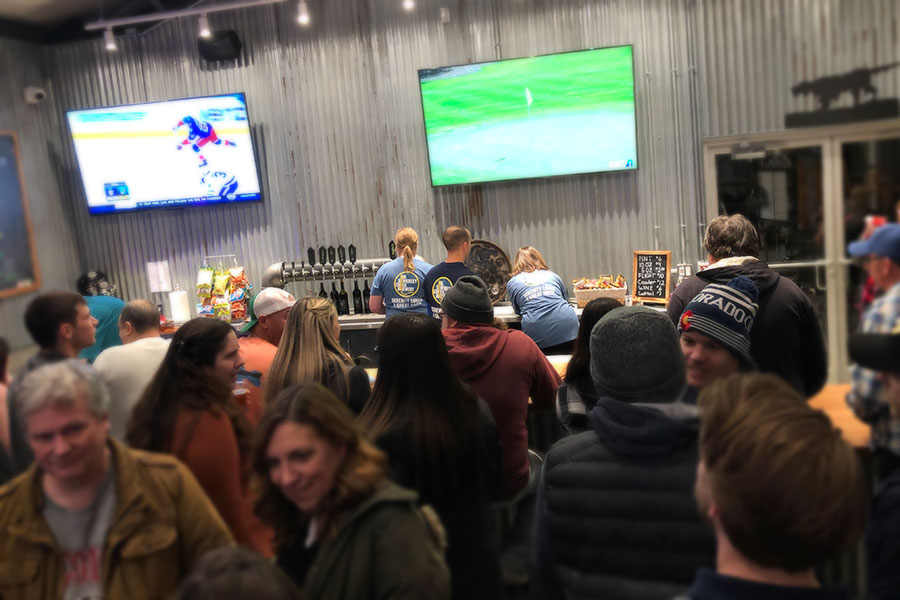 Packed crowd inside bar